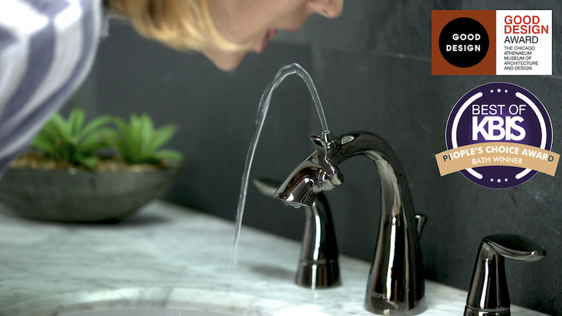 Older woman drinking water from Centerset Nasoni Fountain Faucet