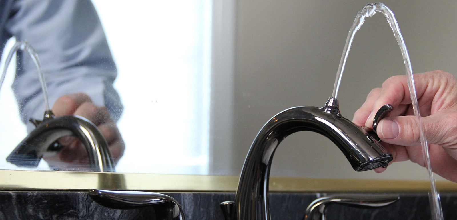 Individual turning the lever on of the Nasoni Fountain Faucet